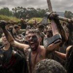 Los vikingos toman Catoira un año más en una Romería llena de barro y risas